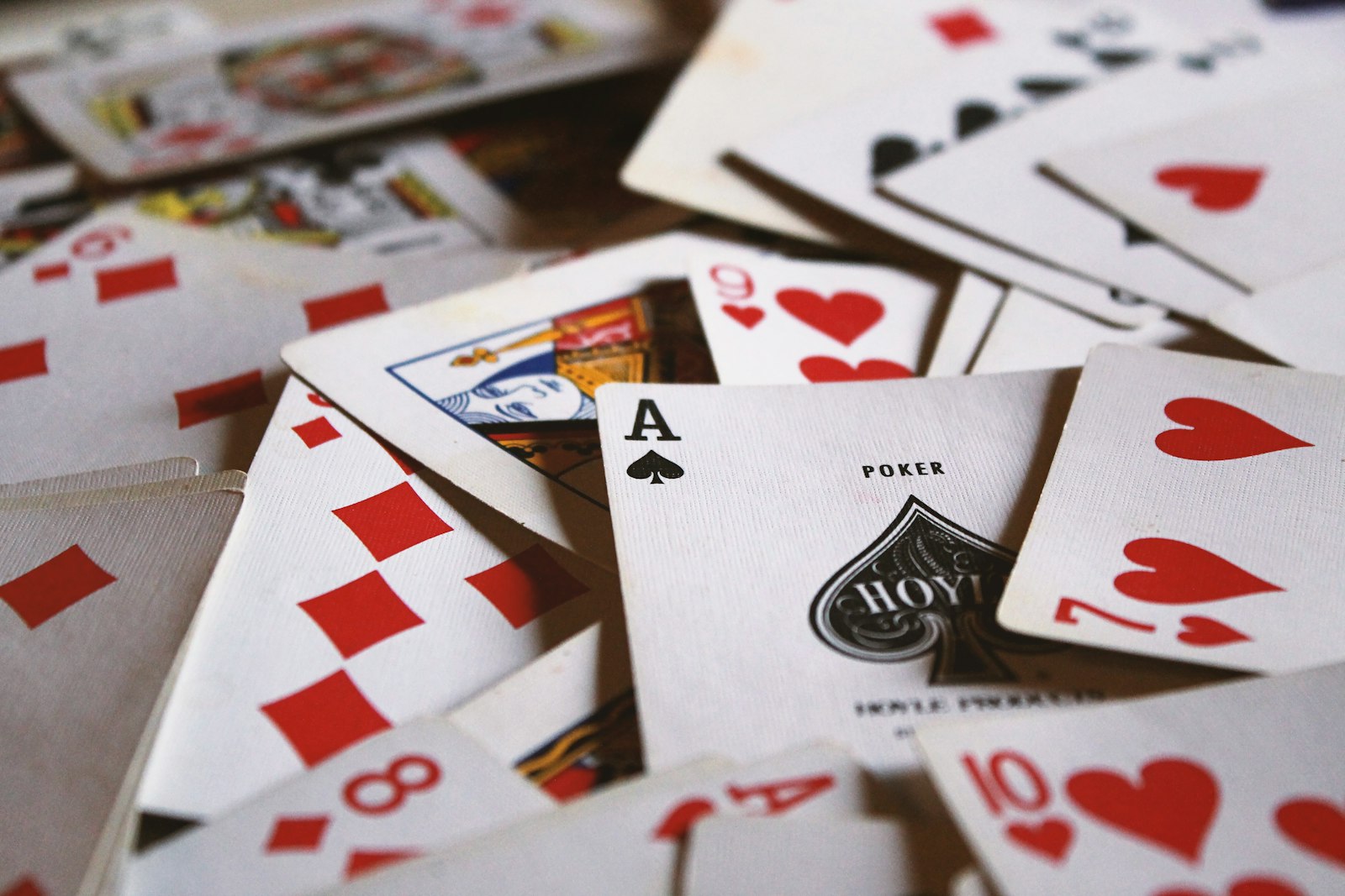 Playing cards scattered face up across a surface