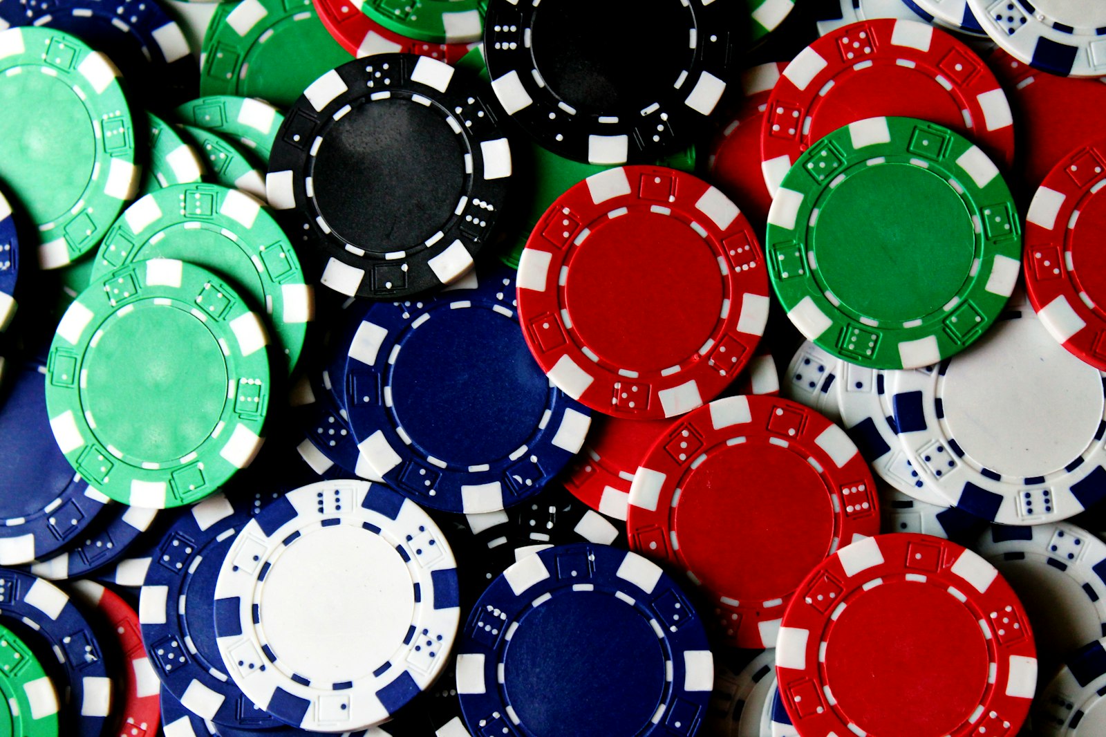 Poker chips scattered loosely across a table